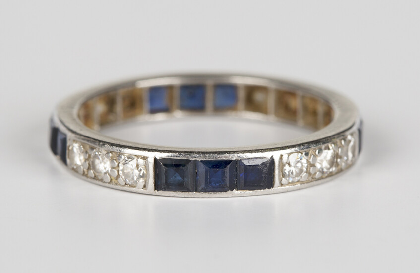 A diamond and sapphire full eternity ring, mounted with four rows of three circular cut diamonds alt