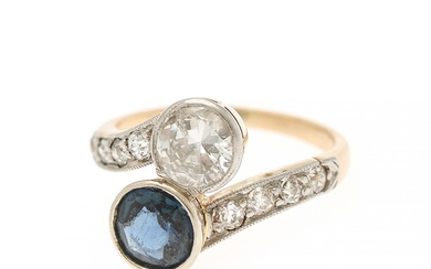 A diamond- and sapphire ring set with a diamond, app. 0.63 ct., and a synthetic sapphire, app. 0.76 ct., mounted in 14k gold and white gold. Size 45.
