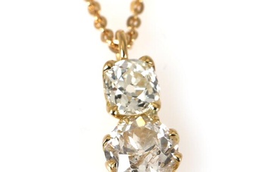A diamond pendant set with two old mine-cut diamonds weighing a total...