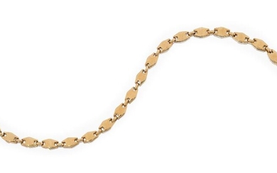 A fancy link bracelet, composed of a series of shaped panels to connecting links, stamped 750, spurious marks, approx. length 21cm