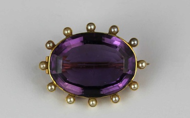 A gold, amethyst and half pearl oval brooch