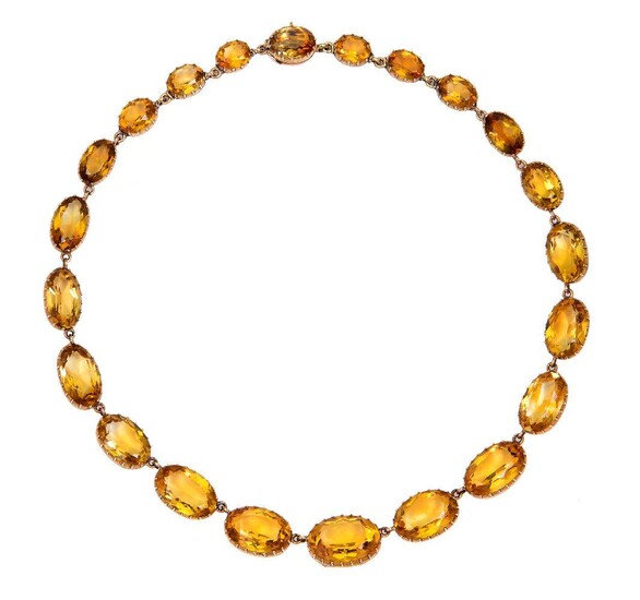 A gold and citrine riviere, composed of a graduated series of oval citrines mounted in pinched collet settings, length 39cm, c.1850