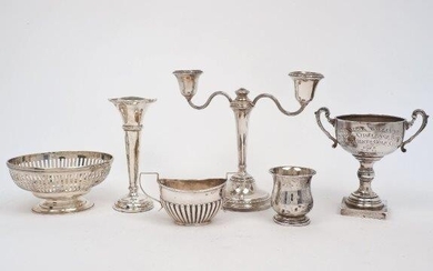 A group of silver comprising: a candlestick with twin branch candelabra attachment, Birmingham, 1960, Adie Bros, 19.6cm high; an Edwardian oval silver dish, London, 1905,John Henry Rawlings, designed with pierced sides and raised on a stepped oval...