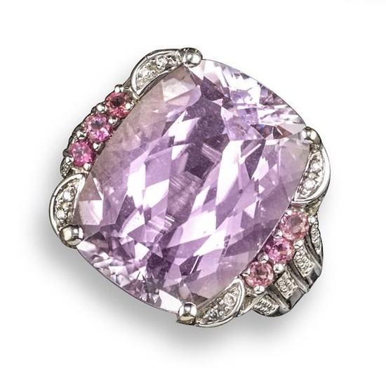 A kunzite and diamond cluster ring, set with...