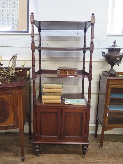 A mid 19th century mahogany whatnot, the four tiers over a p...