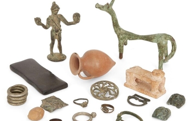 A miscellaneous group of bronze, silver, pottery and stone objects Various Periods, 8th Century B.C. - Modern Including an Italic bow brooch, circa 8th-7th Century B.C., 4.7cm long; two Medusa head appliques, 2.3cm; three bronze rings; a silver...