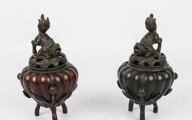A pair of Chinese bronze tripod censers - probably early 20t...
