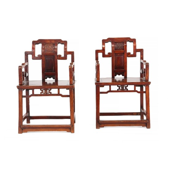A pair of Chinese hardwood armchairs. Early 20th century. (2).