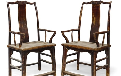 A pair of Chinese lacquered elm armchairs, late 19th century, with central curved splat above solid seats, 110cm high. (2) 十九世紀晚期 榆木扶手椅一對