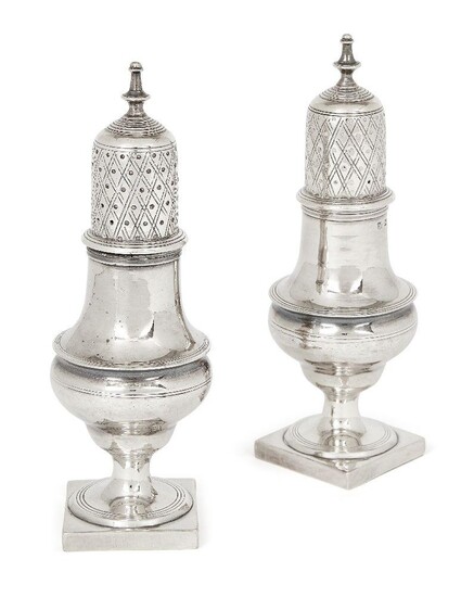 A pair of Georgian silver casters, London, 1801, Samuel & Edward Davenport, of baluster form with crossover chased caps and baluster bodies raised on square feet, 15cm high, total weight approx. 6oz (2)