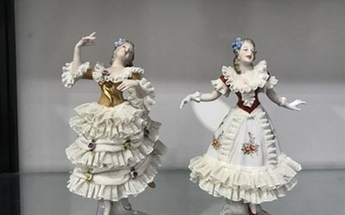 A pair of German porcelain lacework figures, 18cm high (2)