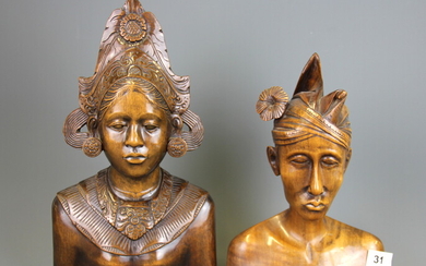 A pair of Indonesian carved hardwood busts, tallest 35cm.