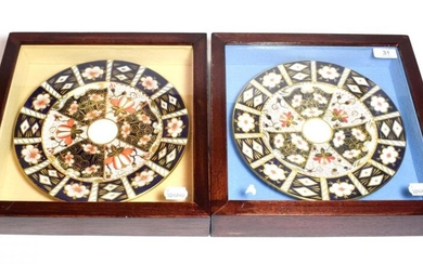 A pair of Royal Crown Derby plates, in framed and...