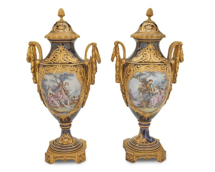 A pair of Sevres-stlye porcelain urns
