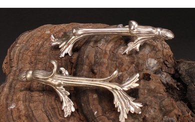 A pair of William IV silver novelty knife rests, cast as lea...