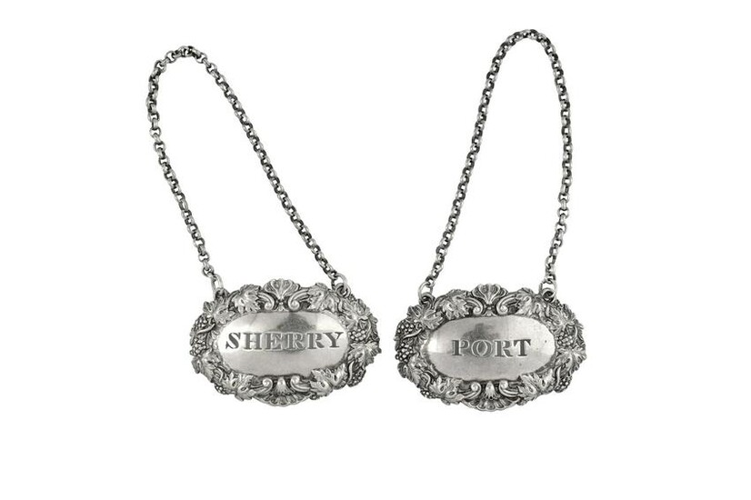 A pair of William IV sterling silver wine labels
