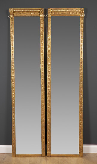A pair of antique tall narrow gilt pier mirrors