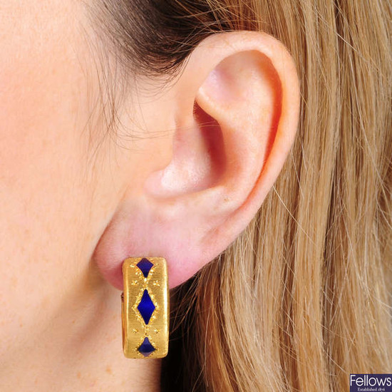 A pair of blue enamel ear hoops, by Buccellati.Diameter