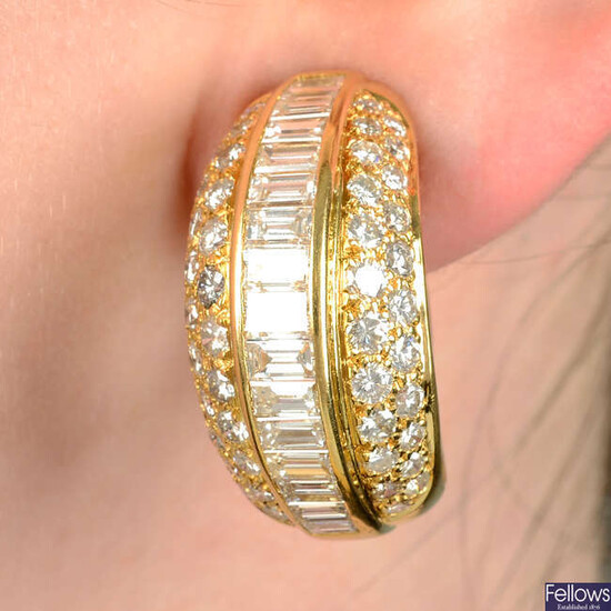 A pair of baguette and brilliant-cut diamond bombé earrings.