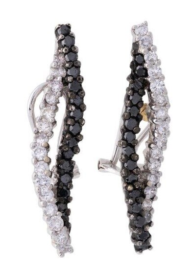 A pair of diamond and black diamond earrings, of flame design set with brilliant-cut diamonds, clip and post fittings, length 3.5cm. Please note that the black diamonds have not been tested for natural colour origin