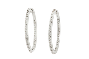 A pair of diamond hoop earrings Each set...