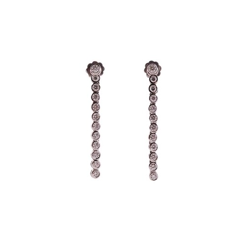 A pair of diamond line drop earrings, each has a dangling en...