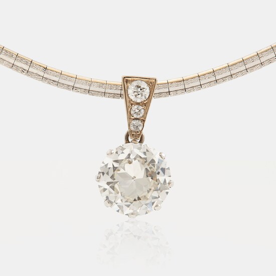 A platinum and 14K white gold pendant set with an old-cut diamond weight ca 3.00 cts quality ca K/L vs