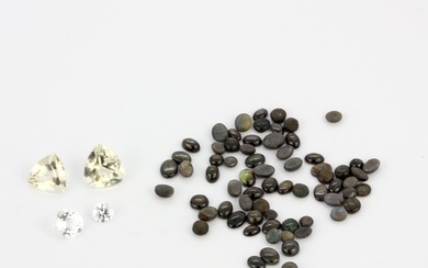 A quantity of unmounted gemstones including cabochon black star diopsides, approx. 49.86ct total, and fancy cut quartz, approx. 13.53ct tota