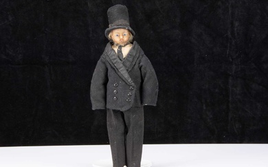 A rare 19th century English poured wax gentleman doll