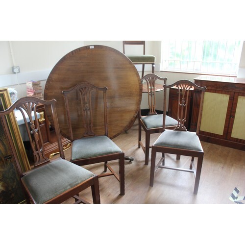 A reproduction mahogany circular snap-top breakfast table, o...