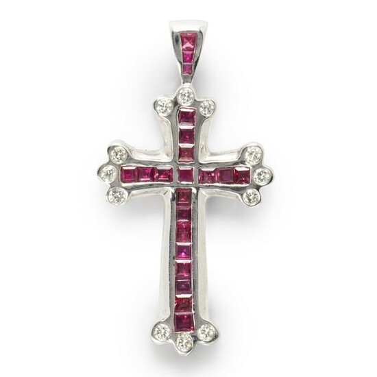 A ruby, diamond and fourteen karat white gold pendant