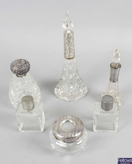 A selection of silver mounted or lidded glass dressing table bottles and jars, plus an assortment of silver mounted button hooks and shoe horns, etc. (25).