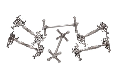 A set of four William IV silver knife rests by Benjamin Stephens