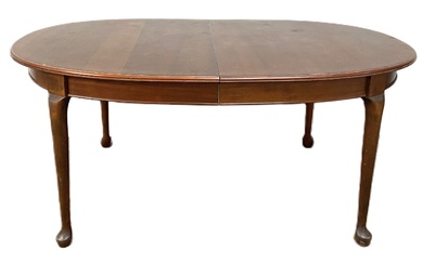 A small vintage Victorian style mahogany dining table, with oval top on four legs with pad feet