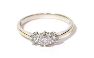 A three stone diamond ring, stamped '18K' and '750', finger...