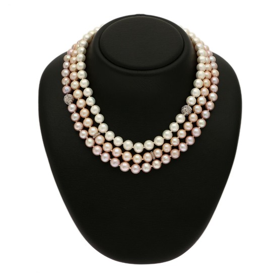 A three string pearl necklace set with numerous cultured freshwater pearls. Spacers set with numerous brilliant-cut brown diamonds, mounted in 14k white gold.