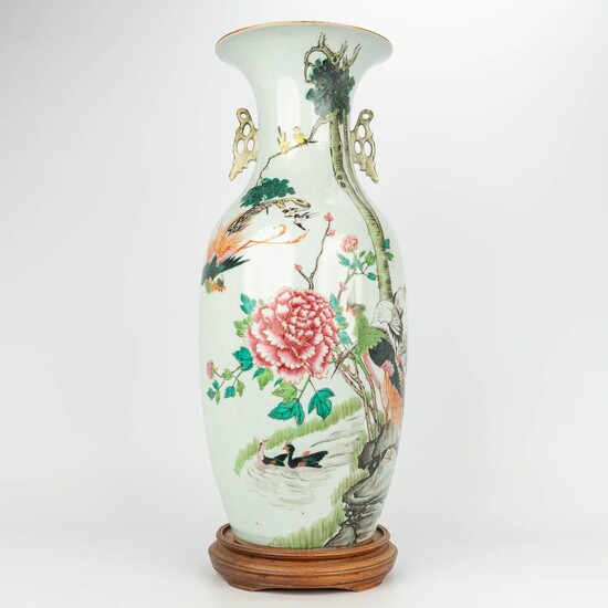 A vase made of Chinese porcelain, Famille rose and decorated with fauna and flora. 19th/20th...