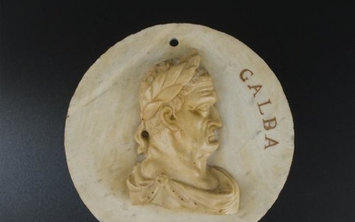 A white marble and giallo di Siena medallion