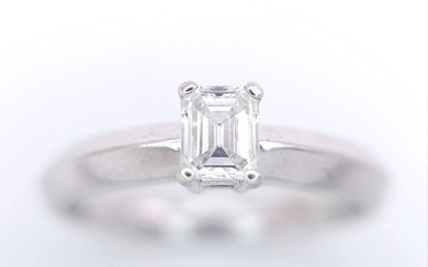 AN 18K WHITE GOLD EMERALD CUT DIAMOND SOLITAIRE RING....