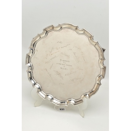 AN EARLY 20TH CENTURY SILVER SALVER, circular form with wavy...
