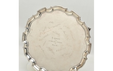 AN EARLY 20TH CENTURY SILVER SALVER, circular form with wavy...