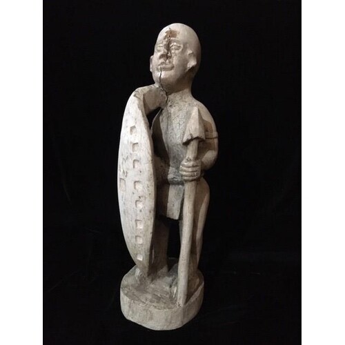AN EARLY 20TH CENTURY TRIBAL WOODEN CARVED FIGURE Standing p...