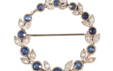 AN EDWARDIAN SAPPHIRE AND DIAMOND CIRCLET BROOCH in the form...