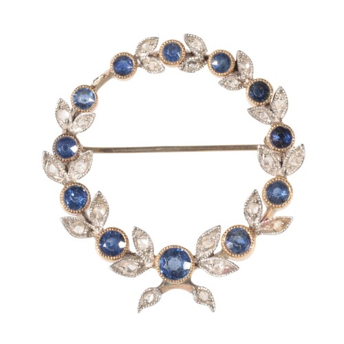 AN EDWARDIAN SAPPHIRE AND DIAMOND CIRCLET BROOCH in the form...