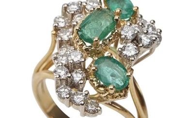 AN EMERALD AND DIAMOND RING - Of abstract design, comprising three oval cut emeralds, within a round brilliant cut diamond set surro...