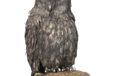 AN ITALIAN SILVER AND PETRIFIED WOOD MODEL OF AN OWL...