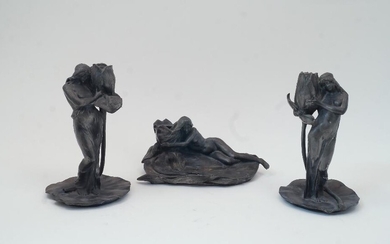 After Alexandre Clerget, French, 1865-1931, two pewter figural candlesticks, each modelled as a half-nude maiden holding an oversized tulip to a lily-pad base, each signed A. Clerget with foundry stamp for Siot-Decauville, Paris, each 23.5cm high;...