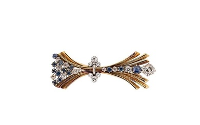 An 18ct gold diamond and sapphire brooch
