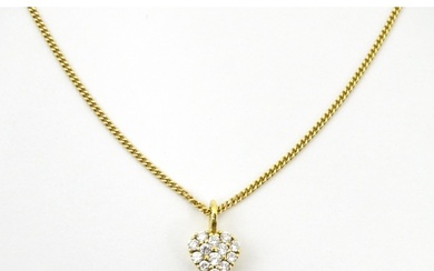An 18ct gold necklace with heart shaped pendant set with a p...