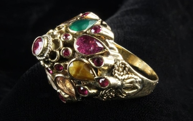 An 18th Carat Yellow Gold Marharja Ring set with Rubies, and teardrop petals of rubies, sapphire, em